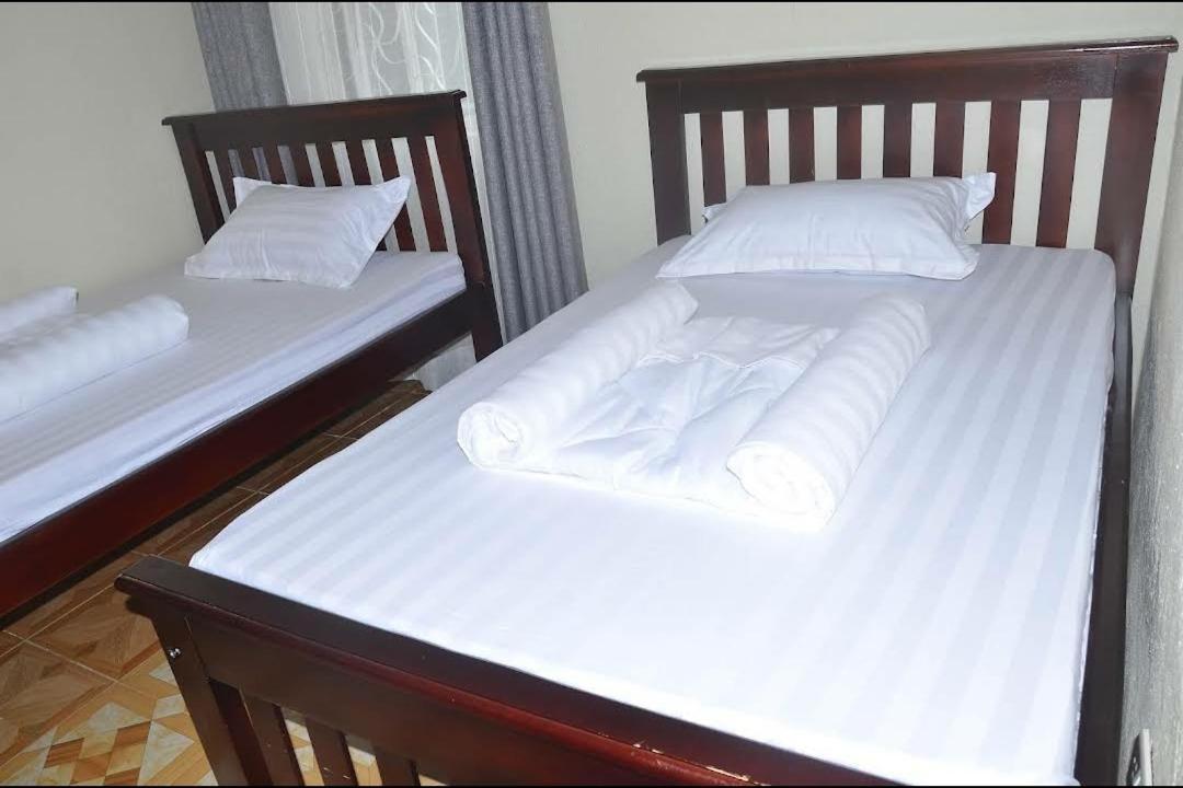 Migingo Suites Энтеббе Экстерьер фото